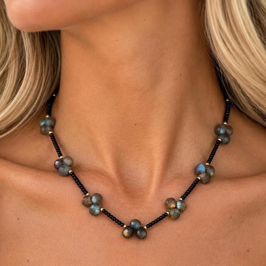 Black spinel necklace worn at the neckline