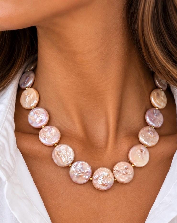 Freshwater pearl necklace worn at the neckline